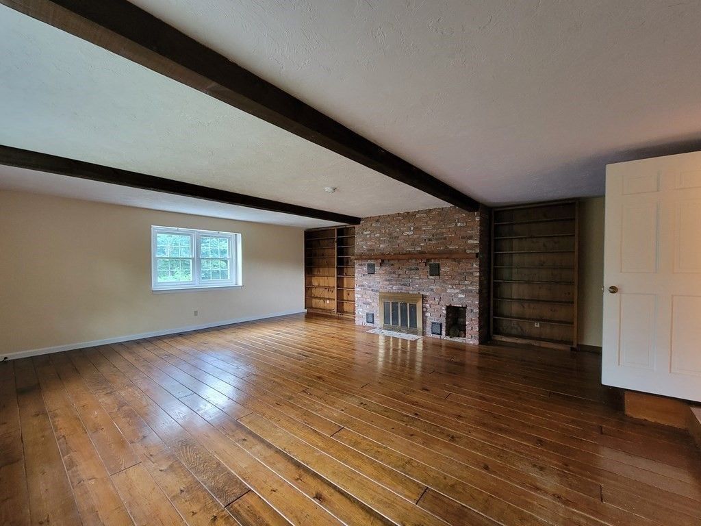 Empty room, Fireplace, Interior, Stone Walls, Wooden Beams, Wood Texture Flooring