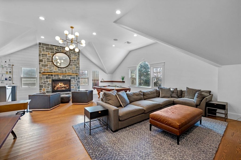 Billiard Table, Fireplace, Game Room, Interior, Living room, Pendant Lights, Recessed Lighting, Stone Walls, Wood Texture Flooring