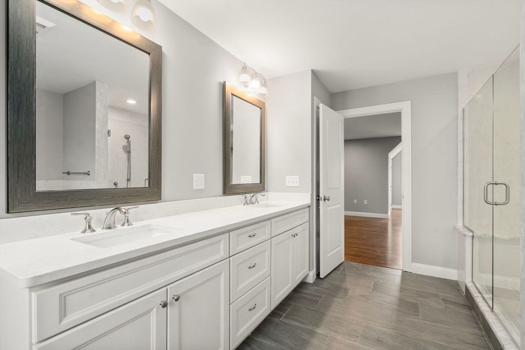 Bathroom, Dual Sink Vanities, Glass Shower, Interior, Marble Walls, Recessed Lighting