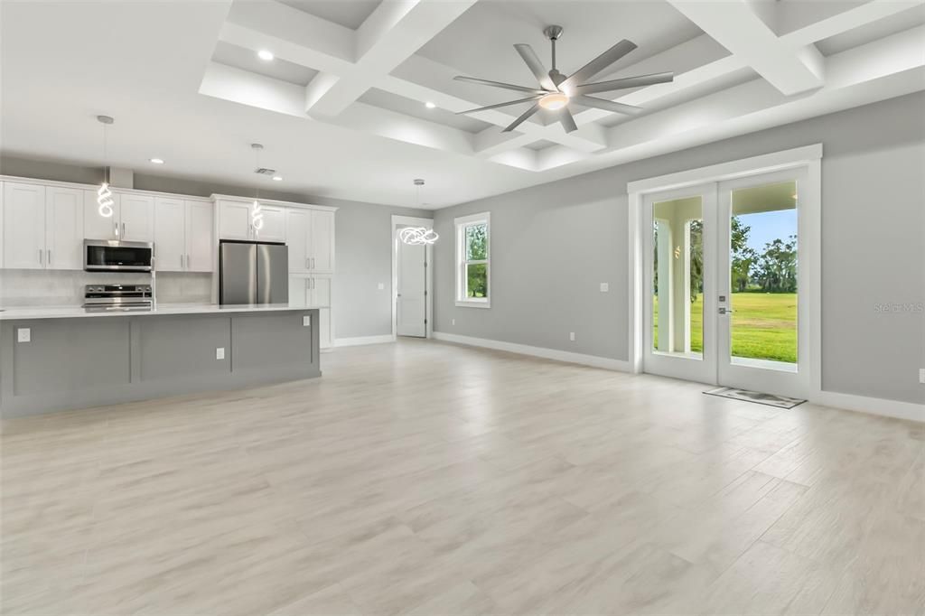 Empty room, Interior, Kitchen, Pendant Lights, Recessed Lighting, Stainless Steel Appliances, Wood Texture Flooring