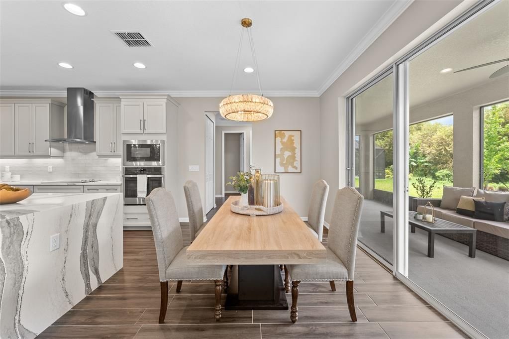 Dining room, Interior, Kitchen, Pendant Lights, Recessed Lighting, Stainless Steel Appliances, Wood Texture Flooring