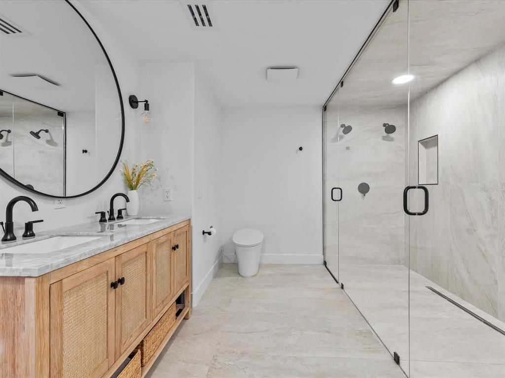 Bathroom, Dual Sink Vanities, Glass Shower, Interior, Marble Walls, Recessed Lighting