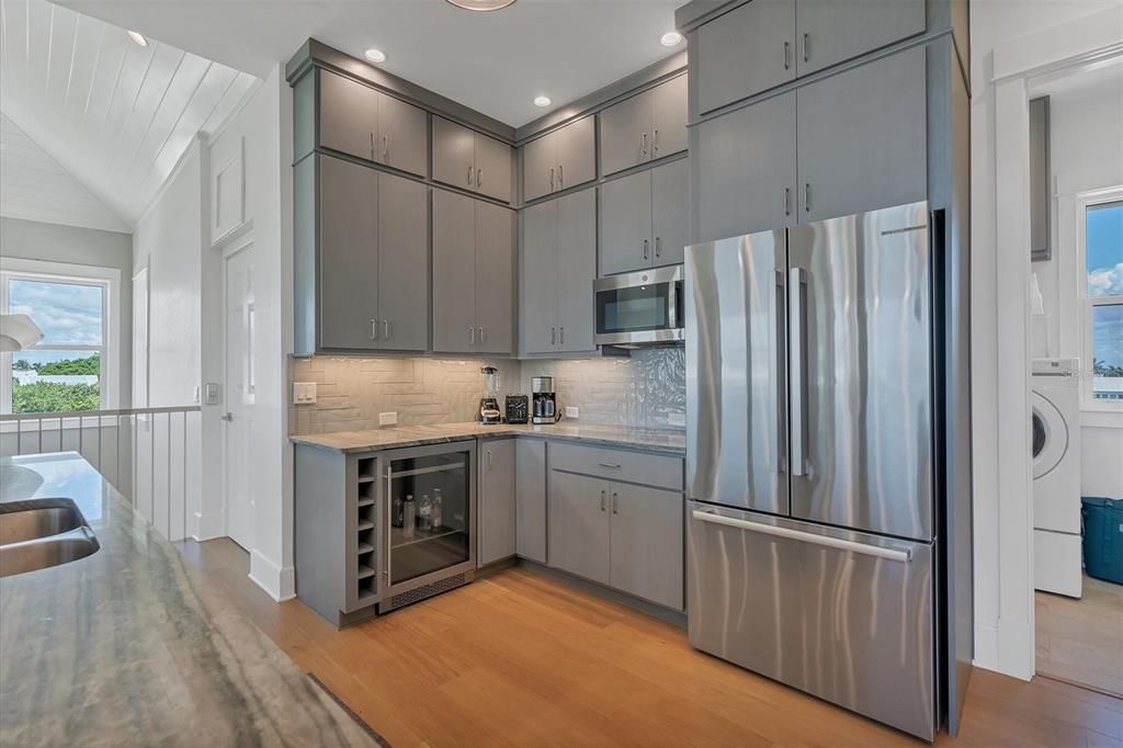Interior, Kitchen, Recessed Lighting, Stainless Steel Appliances, Washer, Wood Texture Flooring