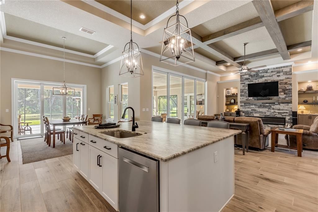 Dining room, Fireplace, Interior, Kitchen, Living room, Pendant Lights, Recessed Lighting, Stainless Steel Appliances, Stone Walls, Wooden Beams, Wood Texture Flooring
