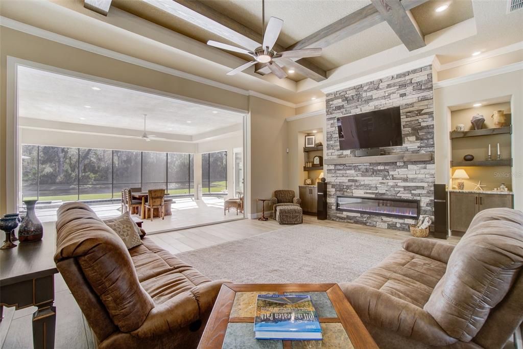 Fireplace, Interior, Living room, Recessed Lighting, Stone Walls, Wood Texture Flooring