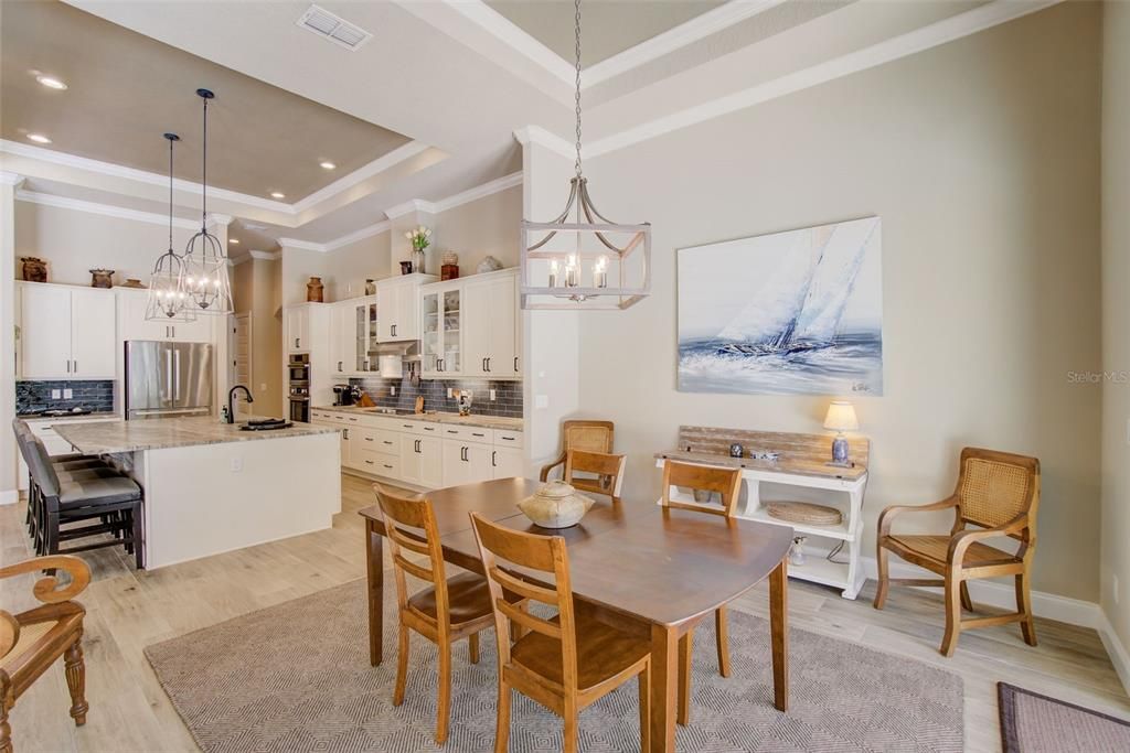 Chandelier, Dining room, Interior, Kitchen, Pendant Lights, Recessed Lighting, Stainless Steel Appliances, Wood Texture Flooring