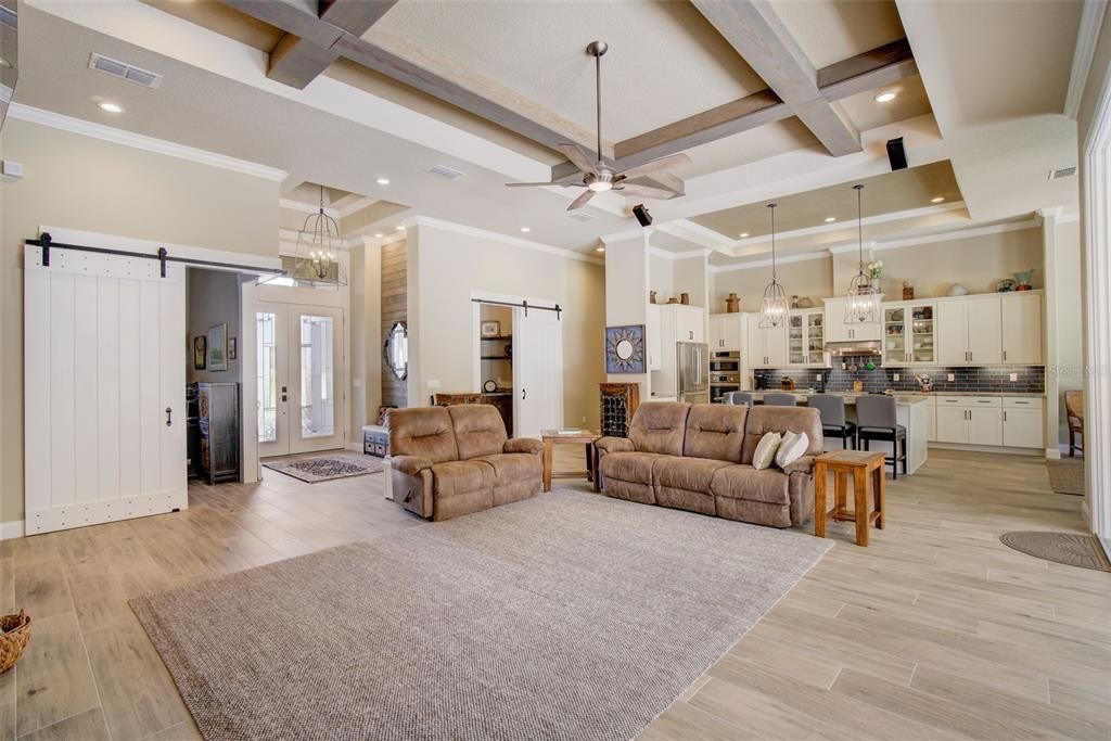 Chandelier, Interior, Kitchen, Living room, Pendant Lights, Recessed Lighting, Stainless Steel Appliances, Wood Texture Flooring