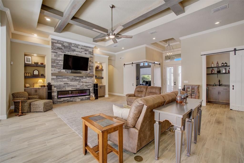 Fireplace, Interior, Living room, Pendant Lights, Recessed Lighting, Stone Walls, Wooden Beams, Wood Texture Flooring