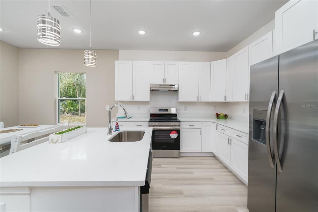 Interior, Kitchen, Pendant Lights, Recessed Lighting, Stainless Steel Appliances, Wood Texture Flooring