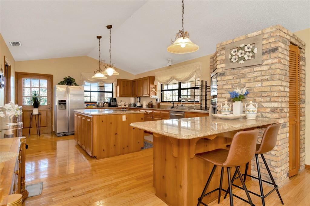 Interior, Kitchen, Pendant Lights, Stainless Steel Appliances, Stone Walls, Wood Texture Flooring
