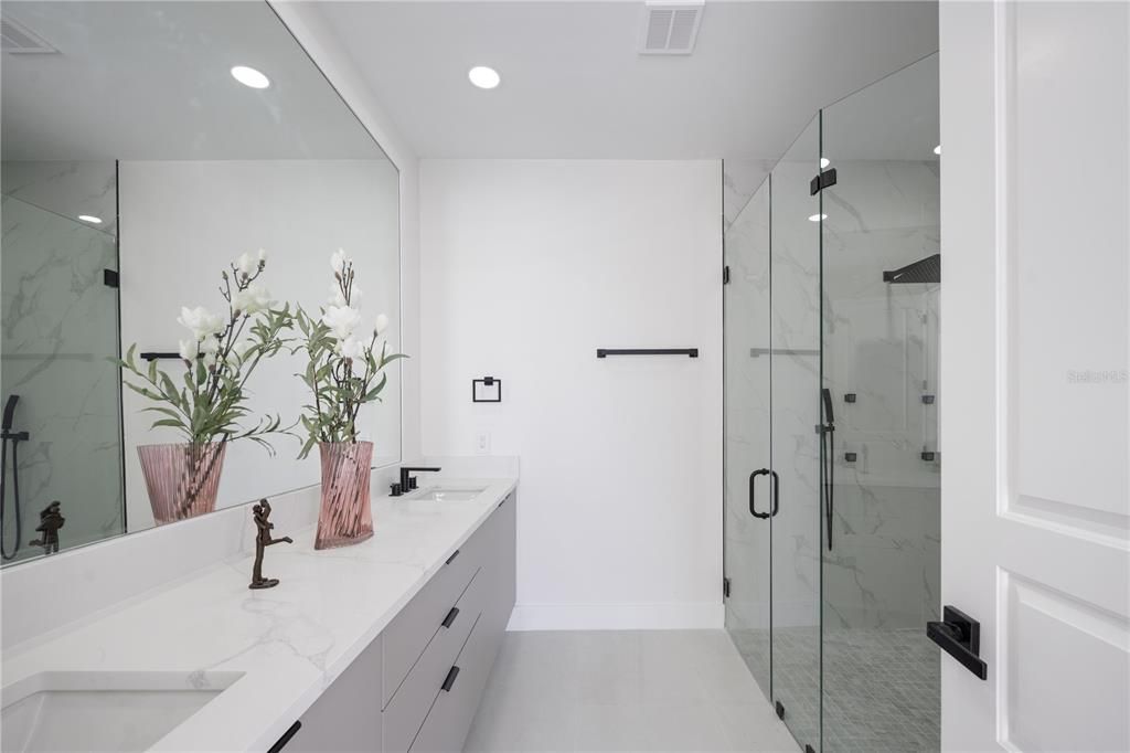 Bathroom, Dual Sink Vanities, Glass Shower, Interior, Marble Walls, Recessed Lighting