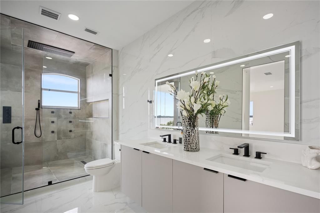 Bathroom, Dual Sink Vanities, Glass Shower, Interior, Marble, Marble Walls, Recessed Lighting