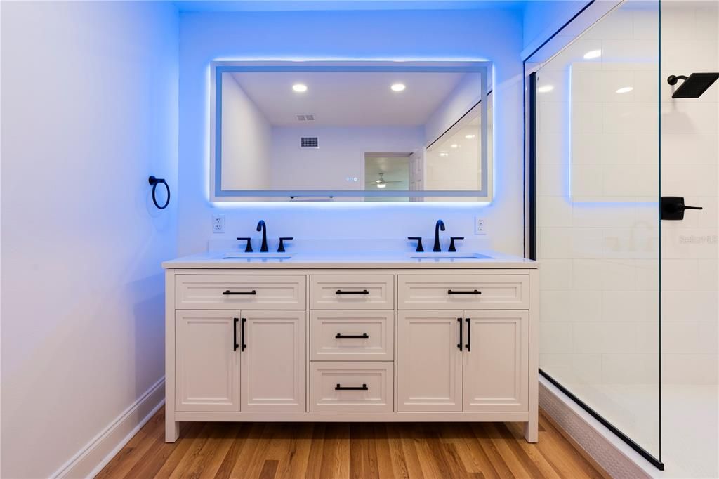 Bathroom, Dual Sink Vanities, Glass Shower, Interior, Recessed Lighting, Wood Texture Flooring