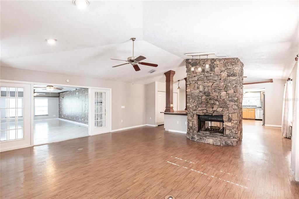 Empty room, Fireplace, Interior, Recessed Lighting, Stone Walls, Wood Texture Flooring
