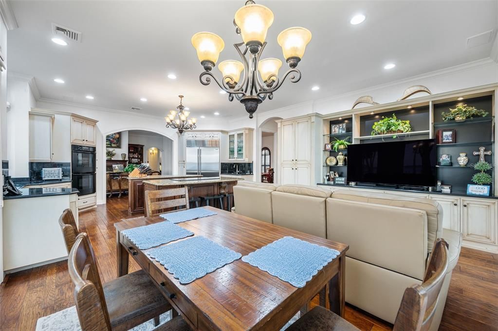 Chandelier, Dining room, Interior, Kitchen, Living room, Recessed Lighting, Stainless Steel Appliances, Wood Texture Flooring
