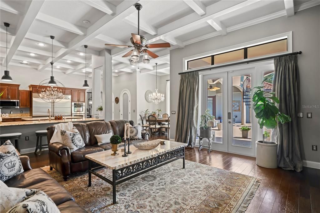 Chandelier, Dining room, Interior, Kitchen, Living room, Pendant Lights, Recessed Lighting, Stainless Steel Appliances, Wood Texture Flooring