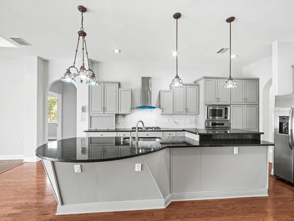 Interior, Kitchen, Pendant Lights, Recessed Lighting, Stainless Steel Appliances, Wood Texture Flooring