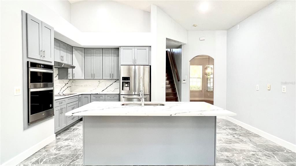 Interior, Kitchen, Marble Walls, Recessed Lighting, Stainless Steel Appliances