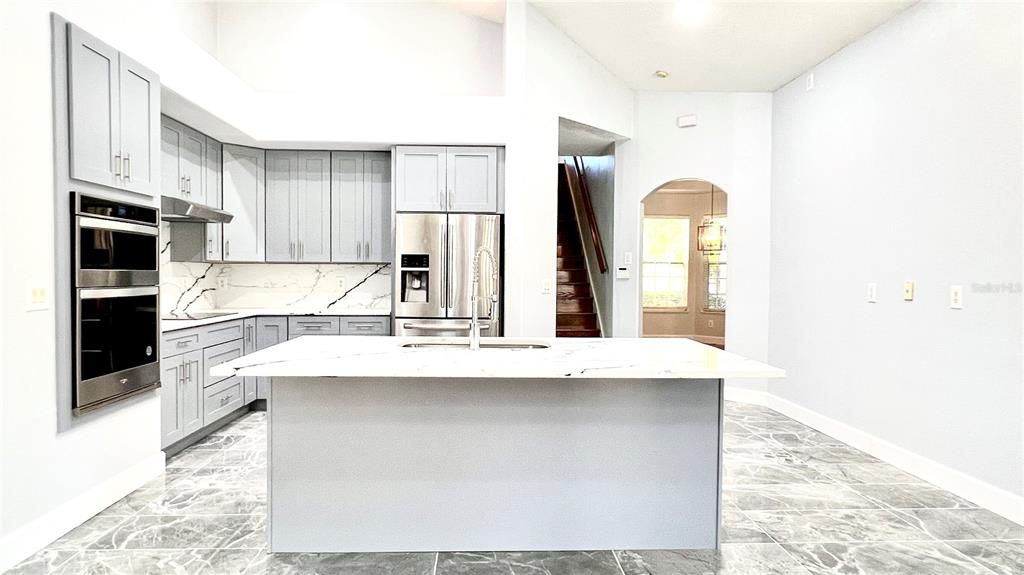 Interior, Kitchen, Marble Walls, Recessed Lighting, Stainless Steel Appliances
