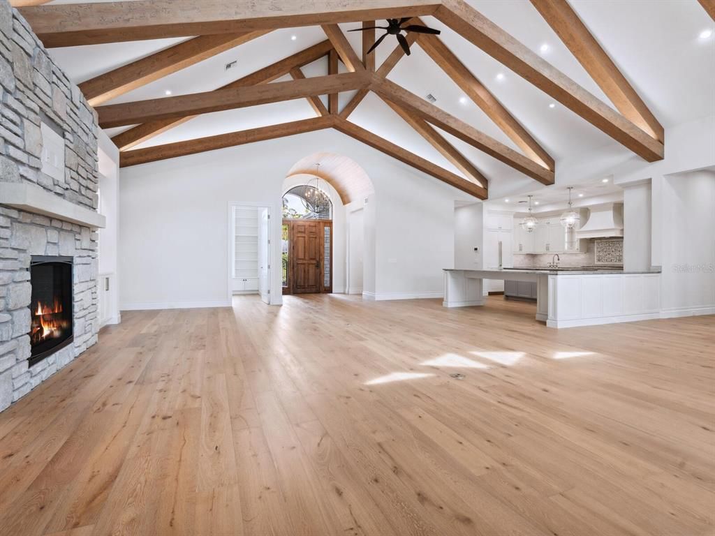 Empty room, Fireplace, Interior, Kitchen, Pendant Lights, Recessed Lighting, Wooden Beams, Wood Texture Flooring