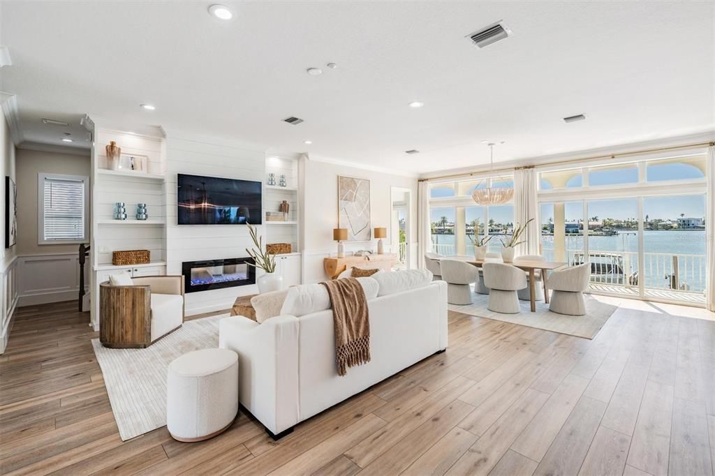 Dining room, Fireplace, Interior, Living room, Pendant Lights, Recessed Lighting, Water, Wood Texture Flooring
