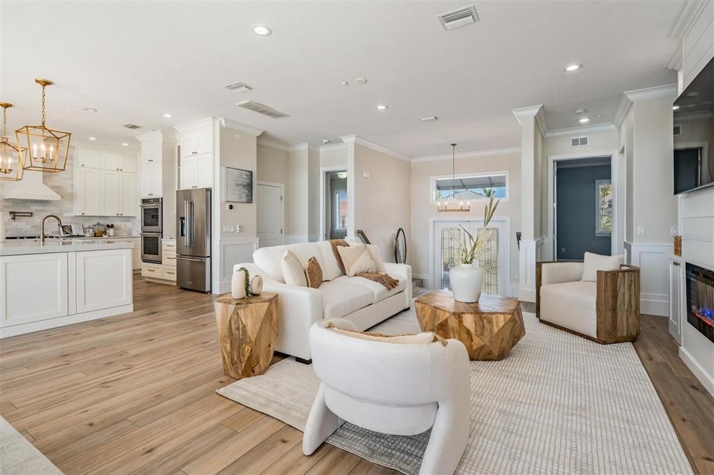 Fireplace, Interior, Kitchen, Living room, Pendant Lights, Recessed Lighting, Stainless Steel Appliances, Wood Texture Flooring