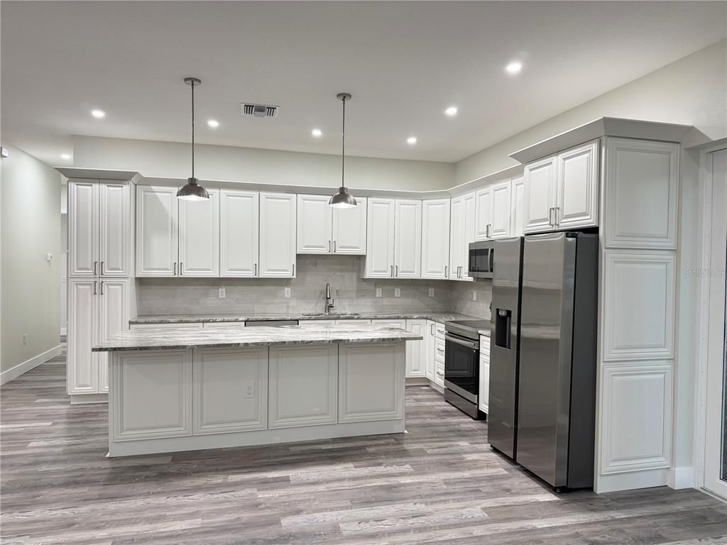 Interior, Kitchen, Pendant Lights, Recessed Lighting, Stainless Steel Appliances, Wood Texture Flooring
