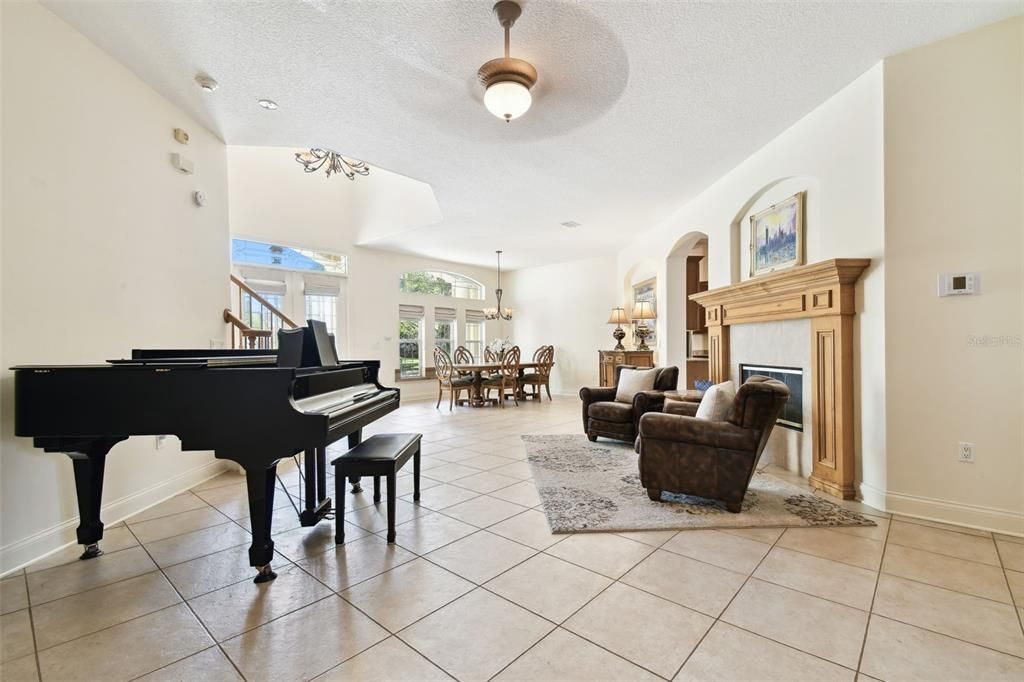 Chandelier, Dining room, Fireplace, Interior, Living room, Piano