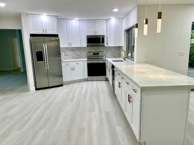 Interior, Kitchen, Pendant Lights, Recessed Lighting, Stainless Steel Appliances, Wood Texture Flooring