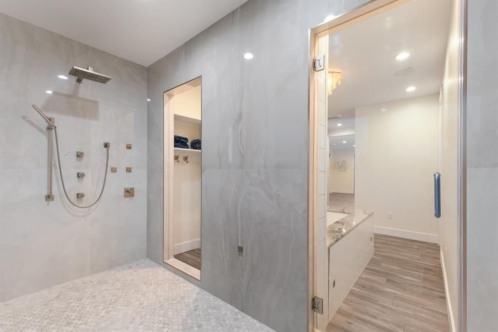 Bathroom, Glass Shower, Interior, Marble Walls, Recessed Lighting, Wood Texture Flooring