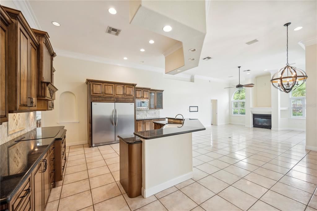 Chandelier, Fireplace, Interior, Kitchen, Pendant Lights, Recessed Lighting, Stainless Steel Appliances