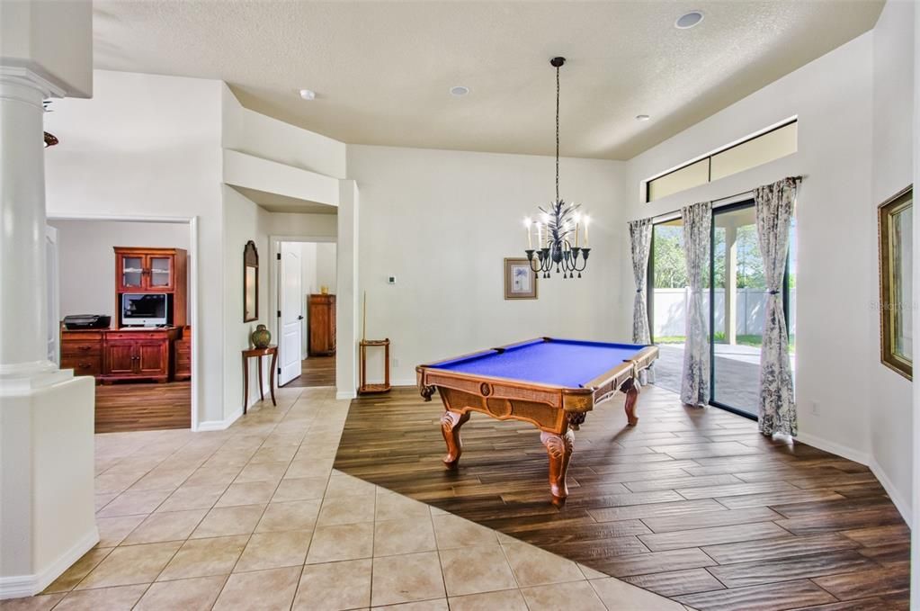 Billiard Table, Chandelier, Game Room, Interior, Pendant Lights, Recessed Lighting, Wood Texture Flooring