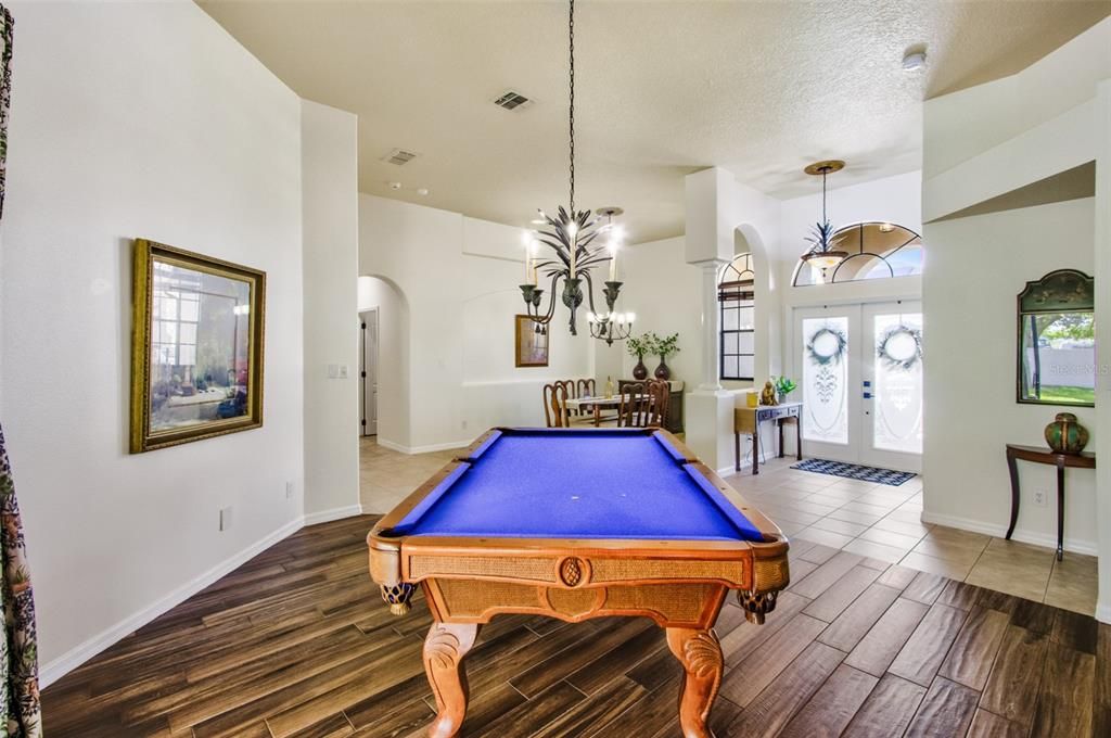 Billiard Table, Chandelier, Game Room, Interior, Pendant Lights, Recessed Lighting, Wood Texture Flooring
