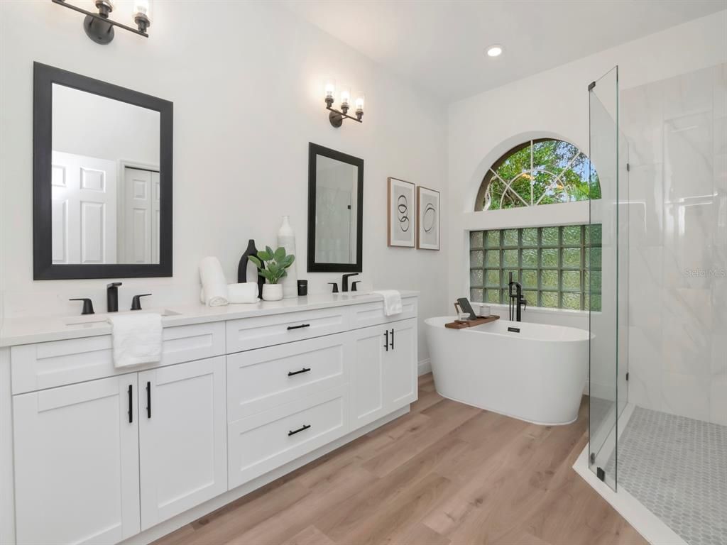 Bathroom, Dual Sink Vanities, Free Standing Baths, Glass Shower, Interior, Recessed Lighting, Wood Texture Flooring