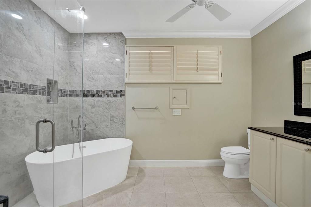 Bathroom, Free Standing Baths, Glass Shower, Interior, Marble Walls, Recessed Lighting