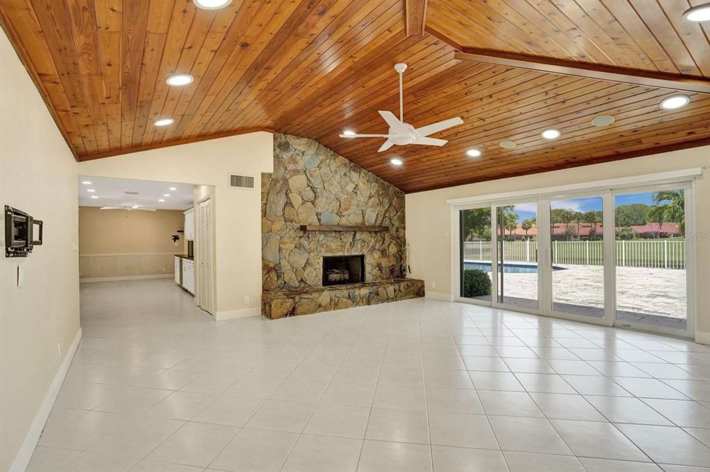 Empty room, Fireplace, Interior, Recessed Lighting, Stone Walls, Wooden Ceilings