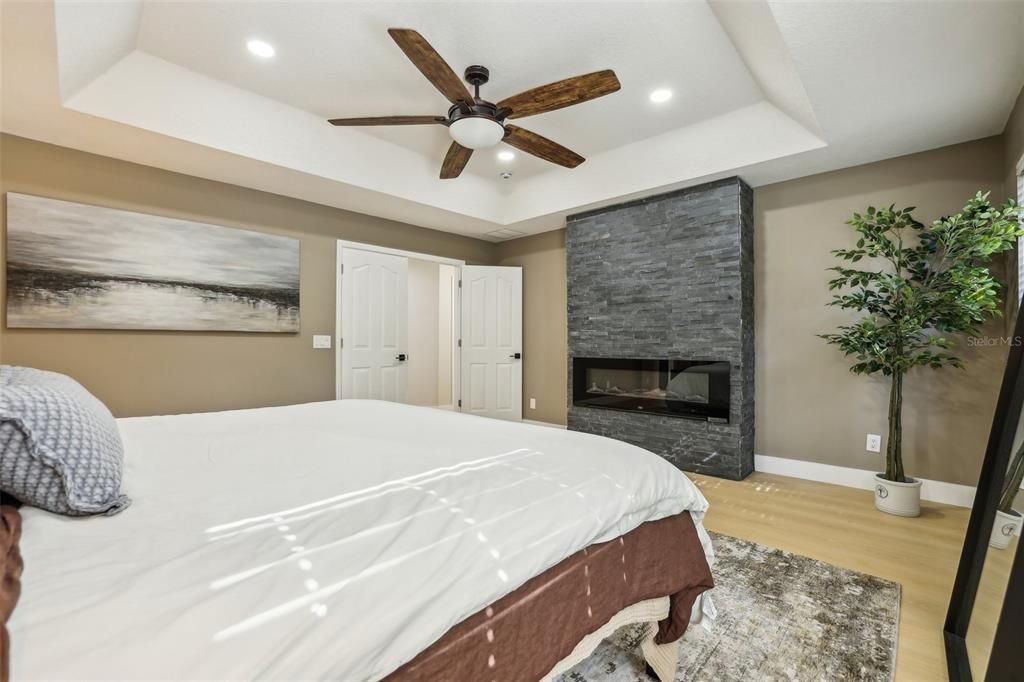 Bedroom, Fireplace, Interior, Recessed Lighting, Wood Texture Flooring