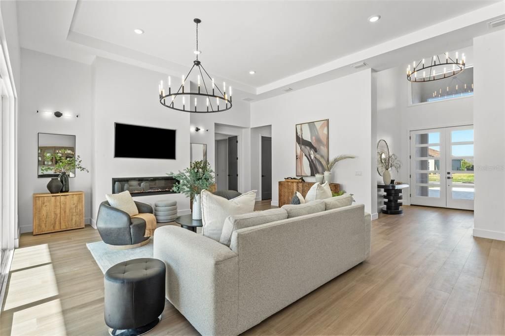 Chandelier, Fireplace, Interior, Living room, Recessed Lighting, Wood Texture Flooring
