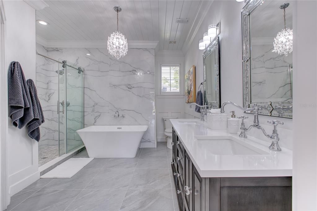 Bathroom, Dual Sink Vanities, Free Standing Baths, Glass Shower, Interior, Marble, Marble Walls, Pendant Lights, Recessed Lighting