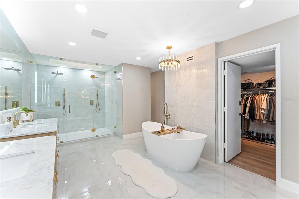 Bathroom, Dual Sink Vanities, Free Standing Baths, Glass Shower, Interior, Marble, Marble Walls, Recessed Lighting, Walk-in Closets, Wood Texture Flooring