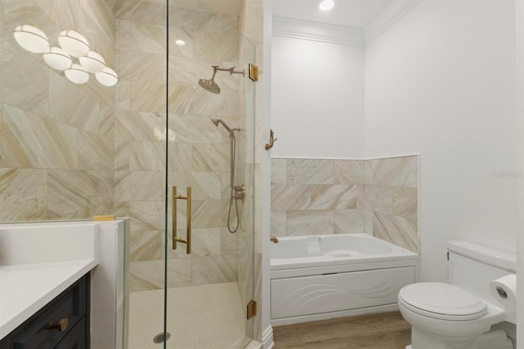 Bathroom, Glass Shower, Interior, Marble Walls, Recessed Lighting, Wood Texture Flooring