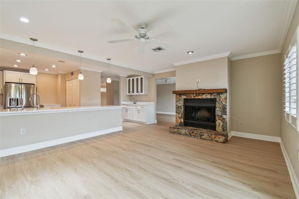 Fireplace, Interior, Kitchen, Pendant Lights, Recessed Lighting, Stainless Steel Appliances, Wood Texture Flooring