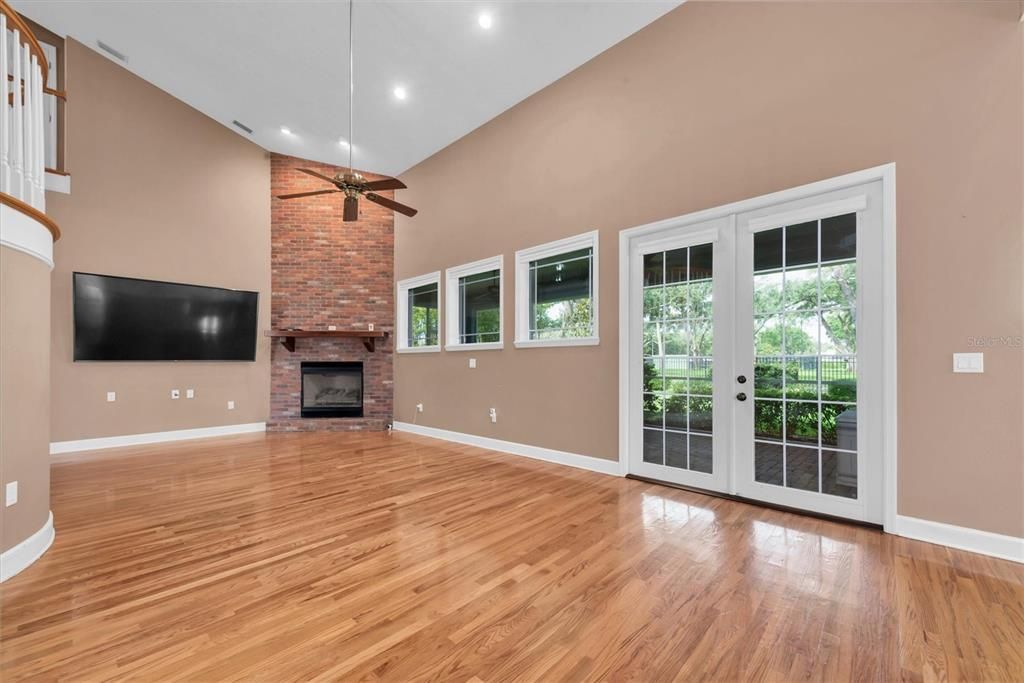 Empty room, Fireplace, Interior, Recessed Lighting, Stone Walls, Wood Texture Flooring