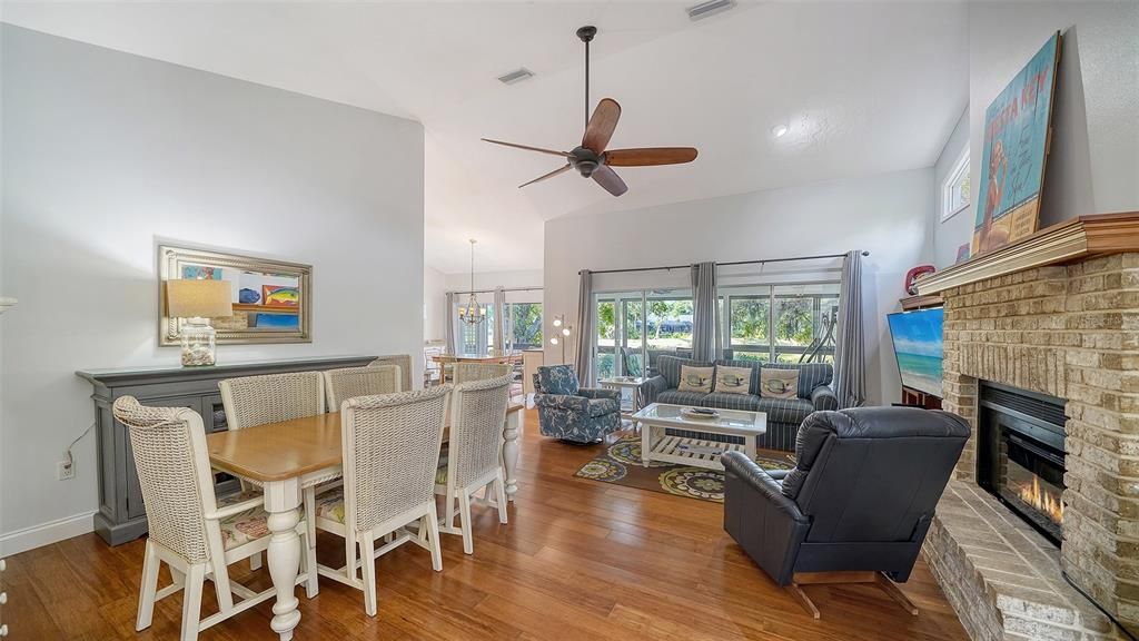 Dining room, Fireplace, Interior, Living room, Pendant Lights, Recessed Lighting, Stone Walls, Wood Texture Flooring