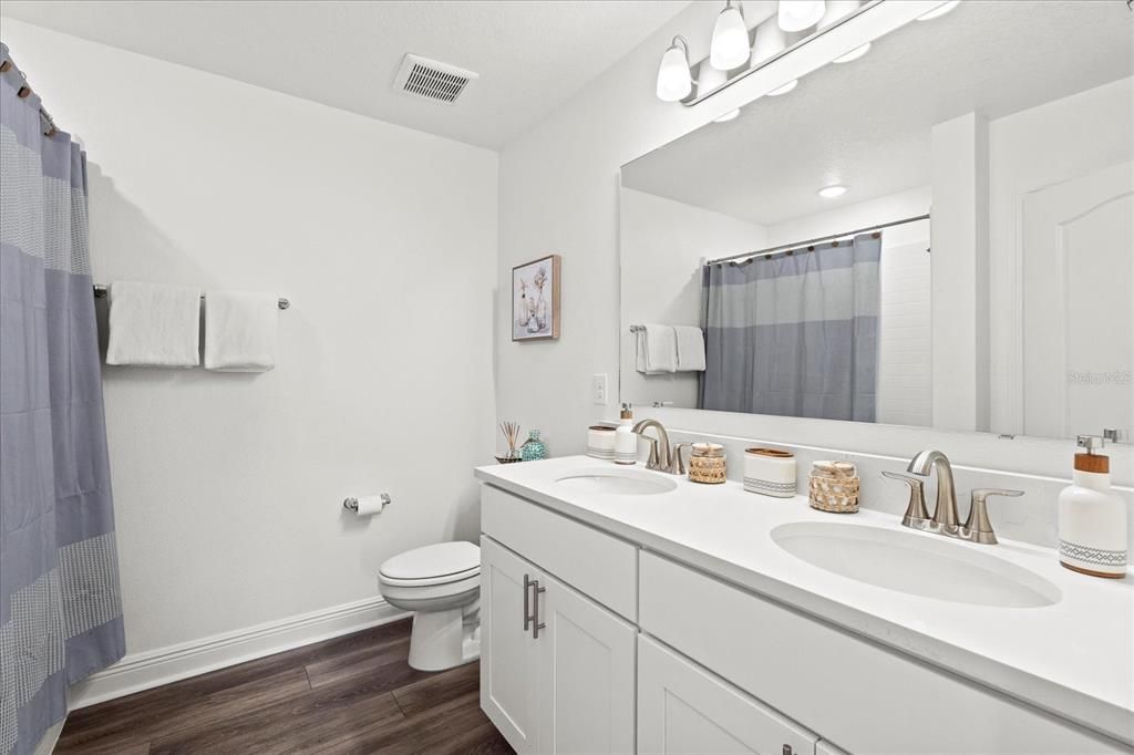 Bathroom, Dual Sink Vanities, Interior, Recessed Lighting, Wood Texture Flooring