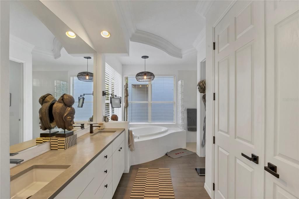 Bathroom, Dual Sink Vanities, Interior, Pendant Lights, Recessed Lighting, Wood Texture Flooring