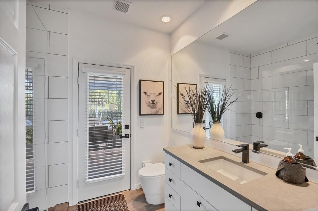 Bathroom, Dual Sink Vanities, Glass Shower, Interior, Recessed Lighting, Wood Texture Flooring