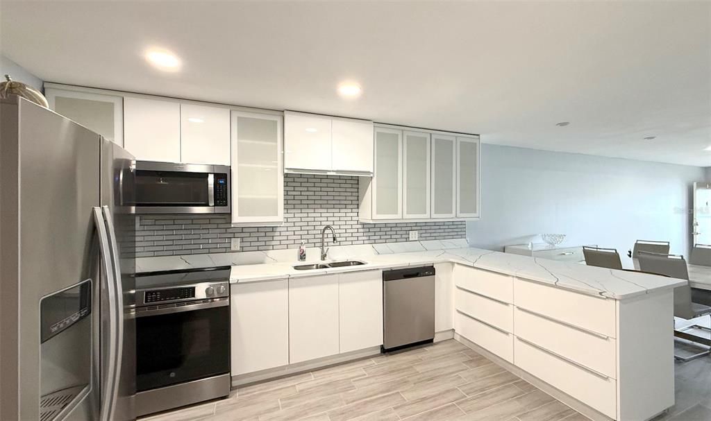 Dining room, Interior, Kitchen, Recessed Lighting, Stainless Steel Appliances, Wood Texture Flooring