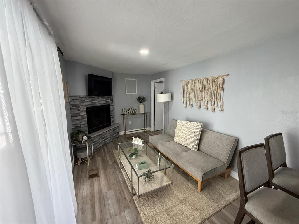 Fireplace, Interior, Living room, Recessed Lighting, Wood Texture Flooring