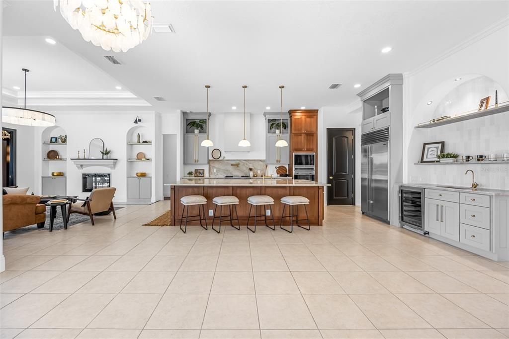 Chandelier, Fireplace, Interior, Kitchen, Living room, Pendant Lights, Recessed Lighting, Stainless Steel Appliances